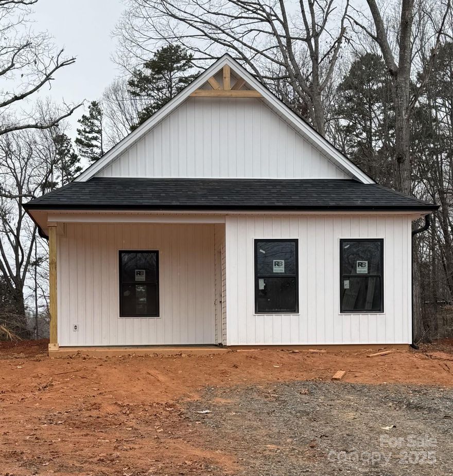This charming new construction home is almost complete, and ready for a homeowner. Nestled on a quiet country road with over a half an acre, there is plenty of room to entertain. Featuring an open floor plan, modern finishes, and a nice backyard. The white board and batten style exterior with black trim gives the perfect contrast. This home feels nice and open with neutral colors and plenty of natural light. You'll love the granite countertops, white shaker cabinets, matte black finishes, and modern lighting. The projected completion date is set for the end of March.
