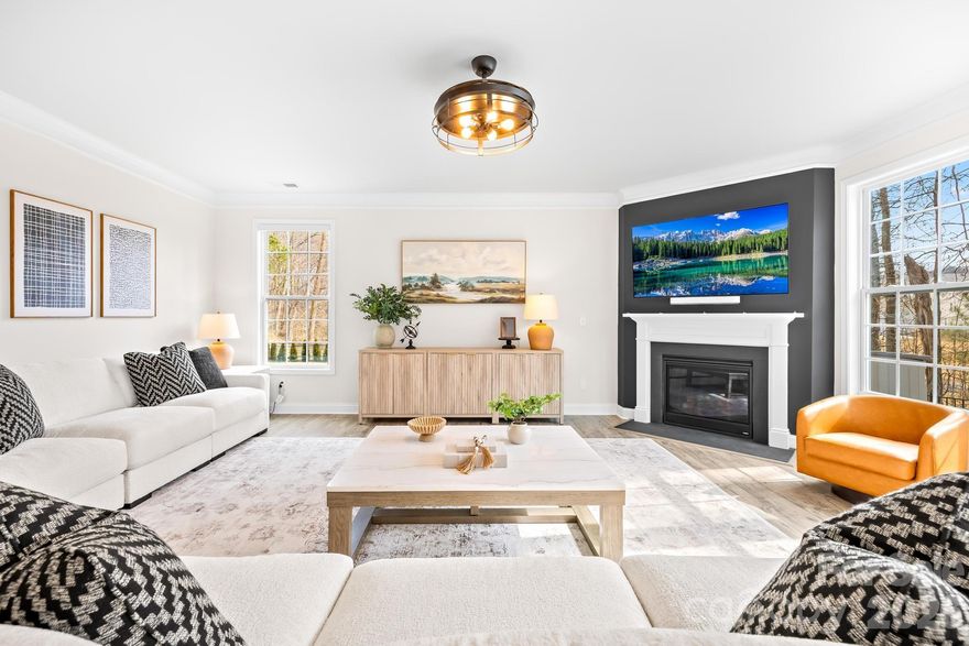 Welcome to this stunning, upgraded, and truly better-than-new Jasmine floorplan, ideally positioned on a private premium 0.44-acre lot in the highly sought-after Enclave at Falls Cove. Only two years old and offering over 4,500 square feet of meticulously maintained living space, this expansive 5-bedroom, 4.5-bathroom residence perfectly combines luxury, functionality, and modern enhancements, creating a home that feels more like a custom build.

From the moment you arrive, the home makes a lasting impression with elegant curb appeal, professional landscaping, and extensive exterior improvements designed to enhance both privacy and outdoor living. Inside, soaring ceilings, wide-plank flooring, and a light neutral palette highlight the home’s open, flowing layout. No detail has been overlooked, with over $100,000 in carefully selected upgrades throughout.

The main level is thoughtfully designed for both everyday comfort and entertaining, featuring a private study with French doors, a generous dining area, mudroom/drop zone with built-ins, oversized living room with gas fireplace, and a desirable guest suite with a full bath. The gourmet kitchen serves as the centerpiece of the home, showcasing custom cabinetry, upgraded quartz countertops, an oversized island, walk-in pantry, breakfast area, custom wood detailing, and an impressive 11-foot kitchen extension complete with three built-in desk spaces — a rare and highly functional addition.

Upstairs, the home continues to impress with abundant storage, a versatile loft area, laundry room, three spacious secondary bedrooms with walk-in closets, and an oversized primary retreat featuring a spa-inspired en-suite bath, expansive sitting room, and oversized walk-in closet.

Step outside to your private backyard oasis, where extensive hardscaping and landscaping create a truly exceptional outdoor environment. Highlights include a custom 500+ square foot patio with built-in fireplace and retaining wall, decorative rock accents, more than 60 Arbor Vitae privacy trees, wrought iron perimeter fencing, and a backyard extension exceeding 30 feet — offering space and seclusion rarely found in this community. An irrigation water meter has already been paid for with the town (not yet installed).

Additional upgrades further elevate the home’s value and convenience, including an epoxy-coated 3-car garage with overhead storage rack system, Tesla wall charger, and Aquasana whole-house water filtration system. Interior enhancements include smart home features, an ADT security system with window and door coverage, front and rear exterior cameras, designer light fixtures, custom wood accent walls, upgraded ceiling fans, and more.

Residents enjoy resort-style amenities including a community pool, clubhouse with fitness center, playground, dog park, open green spaces, and miles of scenic wooded trails. The community’s prime location offers easy access to shopping, dining, Lake Norman State Park, and highly rated Iredell-Statesville Schools.

For buyers seeking space, privacy, and high-end finishes in one of the area’s most desirable neighborhoods, this exceptional Jasmine layout presents a rare opportunity that truly stands apart.