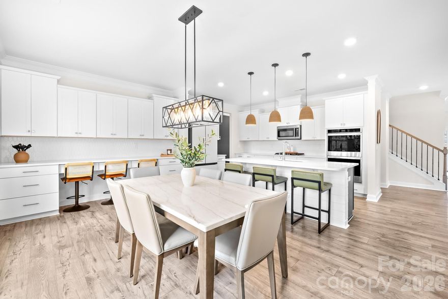 Welcome to 336 Streamwood Rd in Troutman - where peaceful living meets everyday convenience! Check out this stunning, upgraded, and truly better-than-new Jasmine floorplan, ideally positioned on a private premium 0.44-acre lot in the highly sought-after Enclave at Falls Cove. Only two years old and offering over 4,500 square feet of meticulously maintained living space, this expansive 5-bedroom, 4.5-bathroom residence perfectly combines luxury, functionality, and modern enhancements, creating a home that feels more like a custom build.

From the moment you arrive, the home makes a lasting impression with elegant curb appeal, professional landscaping, and extensive exterior improvements designed to enhance both privacy and outdoor living. Inside, soaring ceilings, wide-plank flooring, and a light neutral palette highlight the home’s open, flowing layout. No detail has been overlooked, with over $100,000 in carefully selected upgrades throughout.

The main level is thoughtfully designed for both everyday comfort and entertaining, featuring a private study with French doors, a generous dining area, mudroom/drop zone with built-ins, oversized living room with gas fireplace, and a desirable guest suite with a full bath. The gourmet kitchen serves as the centerpiece of the home, showcasing custom cabinetry, upgraded quartz countertops, an oversized island, walk-in pantry, breakfast area, custom wood detailing, and an impressive 11-foot kitchen extension complete with three built-in desk spaces — a rare and highly functional addition.

Upstairs, the home continues to impress with abundant storage, a versatile loft area, laundry room, three spacious secondary bedrooms with walk-in closets, and an oversized primary retreat featuring a spa-inspired en-suite bath, expansive sitting room, and oversized walk-in closet.

Step outside to your private backyard oasis, where extensive hardscaping and landscaping create a truly exceptional outdoor environment. Highlights include a custom 500+ square foot patio with built-in fireplace and retaining wall, decorative rock accents, more than 60 Arbor Vitae privacy trees, wrought iron perimeter fencing, and a backyard extension exceeding 30 feet — offering space and seclusion rarely found in this community. An irrigation water meter has already been paid for with the town (not yet installed).

Additional upgrades further elevate the home’s value and convenience, including an epoxy-coated 3-car garage with overhead storage rack system, Tesla wall charger, and Aquasana whole-house water filtration system. Interior enhancements include smart home features, an ADT security system with window and door coverage, front and rear exterior cameras, designer light fixtures, custom wood accent walls, upgraded ceiling fans, and more.

Residents enjoy resort-style amenities including a community pool, clubhouse with fitness center, playground, dog park, open green spaces, and miles of scenic wooded trails. The community’s prime location offers easy access to shopping, dining, Lake Norman State Park, and highly rated Iredell-Statesville Schools.

For buyers seeking space, privacy, and high-end finishes in one of the area’s most desirable neighborhoods, this exceptional Jasmine layout presents a rare opportunity that truly stands apart.