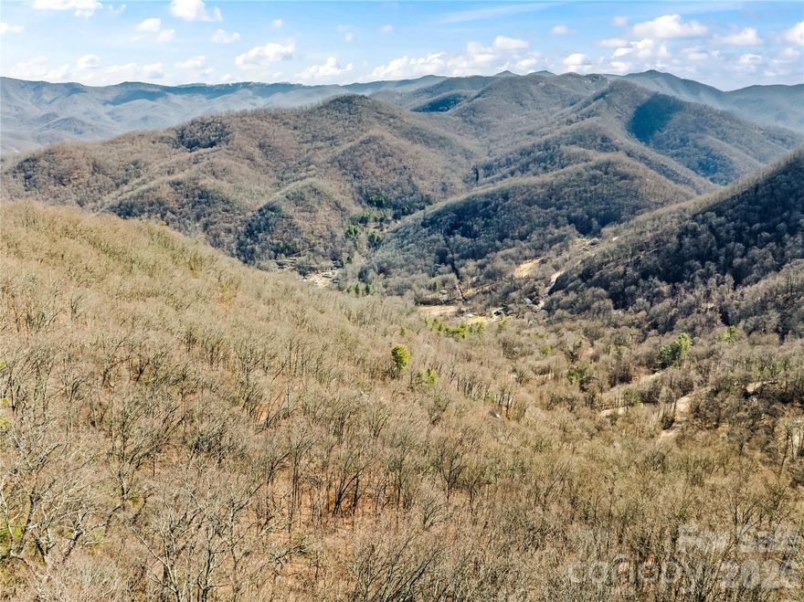 Escape to your own private mountain sanctuary. Nestled within a quiet community, this 12.02-acre property offers exceptional privacy and a true connection to nature. The land is steep, which creates an opportunity for a custom-designed mountain home that embraces the terrain. The property doesn't have a driveway in place, allowing future owners flexibility to design a custom approach. An added benefit is that the HOA maintains the roads in the community. Schedule an appointment today to check this one out yourself!