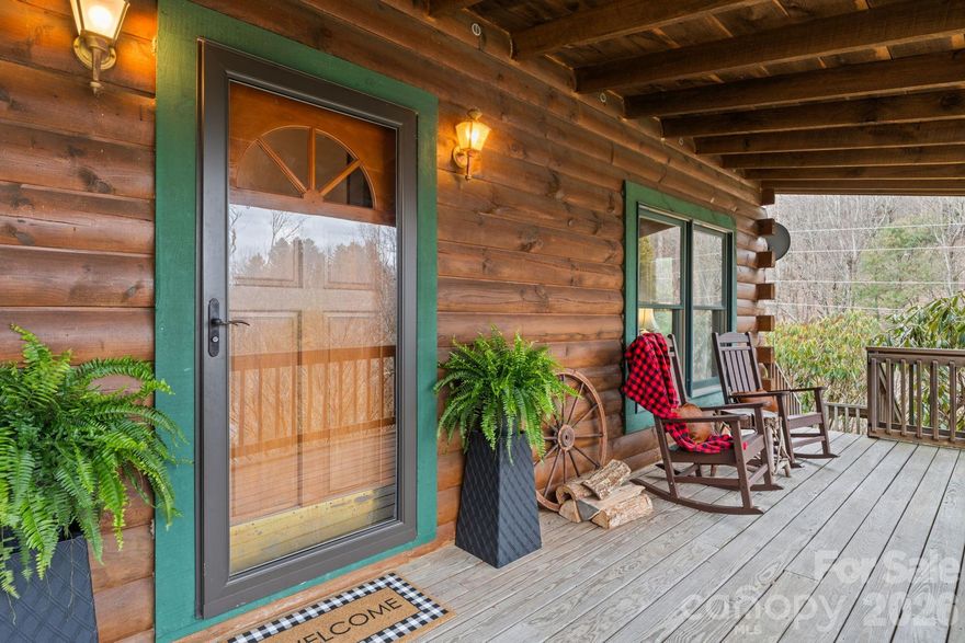 Are you searching for a log cabin in a prime High-Country location? This one sits right between Boone and Blowing Rock, offering easy access to both while maintaining a cozy, mountain feel. Enter from the full-length covered porch into a spacious living room with vaulted ceilings, a wood-burning stove with an antique mantel, and large windows that bring in natural light. The dining area connects to the kitchen, where a back door and deck lead directly to the driveway—making everyday access and bringing in the groceries simple. A carport provides covered parking and added convenience. The split-bedroom layout offers two bedrooms, each with its own full en-suite bath and generous closet space, creating privacy for owners and guests. Set on a double lot, the property offers usable outdoor space with room to add a firepit and/or a hot tub! Located approximately 10 minutes from Appalachian State University, the Blue Ridge Parkway, and the regional medical center, and less than 15 minutes to both Downtown Boone and Blowing Rock. No HOA restrictions and short-term rentals are permitted, providing flexibility for personal use or investment. Recent updates include all new LVP flooring, removal of popcorn ceilings, and fresh interior paint (March 2026)! Central heat and air installed in 2024!