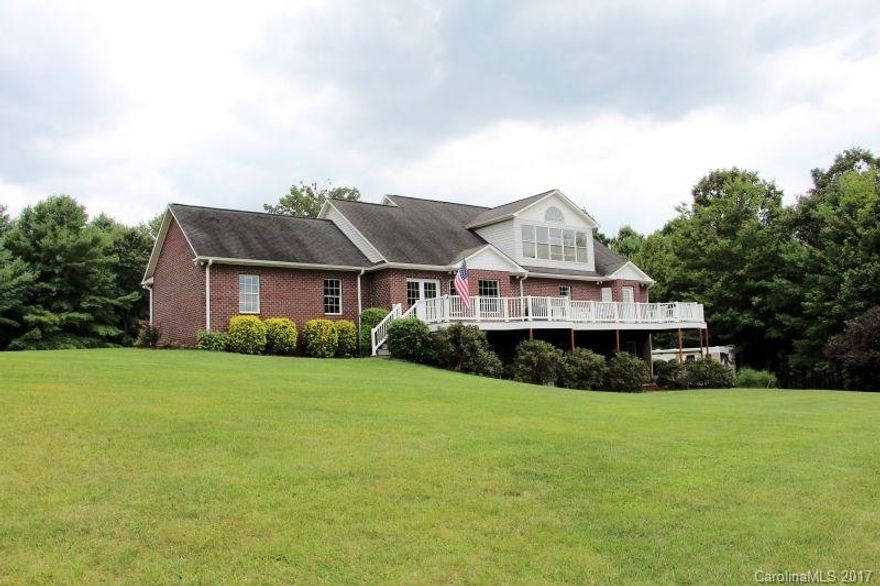 1½ Story, brick home w/full, partially finished basement & bonus room extra lot totaling 1.40 acres. 3BR, 3BA home features a bonus room w/large windows allowing amazing lake views & plantation shutters. LR has a vaulted ceiling, gas logs FP, & custom built-ins. Kitchen w/updated custom cabinets w/ “soft close” pullouts, SS appliances, granite, lighted pantry & a breakfast area. Formal DRw/walk-out to the “Trex” back deck. MBR has a tray ceiling, walk-in closet, MBA & back deck access.