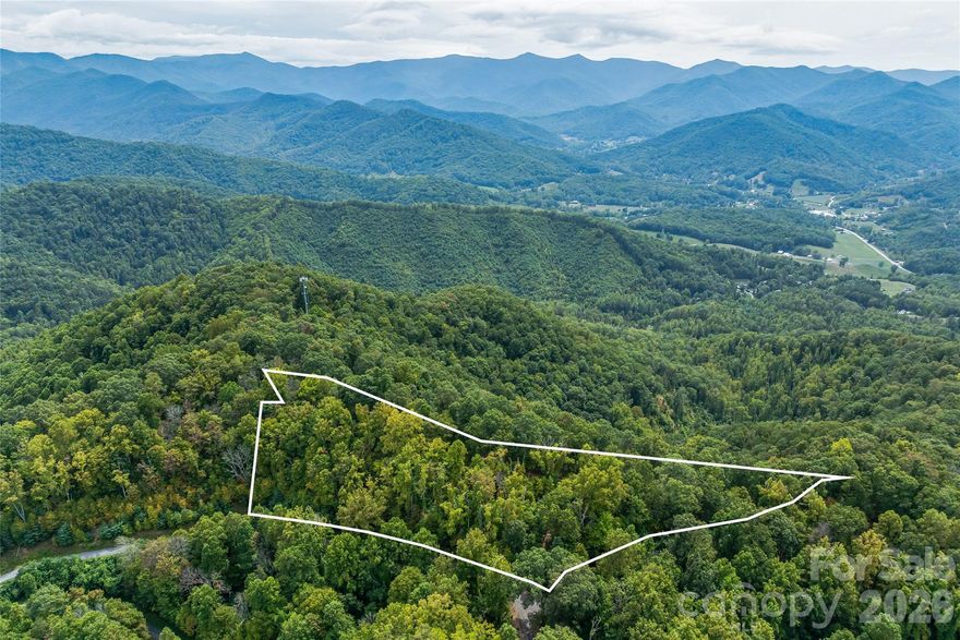 “It’s so peaceful up here.”
This ridge-line lot feels private and pristine, yet it’s remarkably easy to reach. A level building site is ready for your dream home, with underground utilities, a cleared path, and healthy trees all around.

Access is simple—an easy climb for any vehicle—and once you’re here, the views are stunning: currently a 280° winter panorama, with the option to spindle trees for even broader year-round vistas.

The HOA is present but low-key, just $600/year for road upkeep, signage, and maintenance. You’ll love the gorgeous drive in, and you’re only about 10 minutes from I-26.

3 acres. Quiet. Accessible. Scenic.
This is the land you’ve been dreaming about.