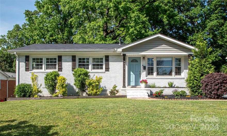 BEAUTIFULLY renovated brick ranch only 10 minutes from Uptown.  This stunning 3 bed, 2 full bath has hardwood floors throughout. Kitchen has been updated with white shaker cabinets, stainless steel appliances, granite countertops, and white tile backsplash.  Extensive counter space is perfect for anyone who loves to cook! Two full baths include tile showers and floors, and two separate living areas provide plenty of living space.  Detached second building with hard to find 1-car garage and two finished rooms that are not included in the SF of the house, which would make the perfect home office, extra closet/storage, gym, art studio, etc. Yard is fully fenced and paved driveway includes a carport for additional covered parking.  New roof and kitchen appliances in 2020. NO HOA! Must see!