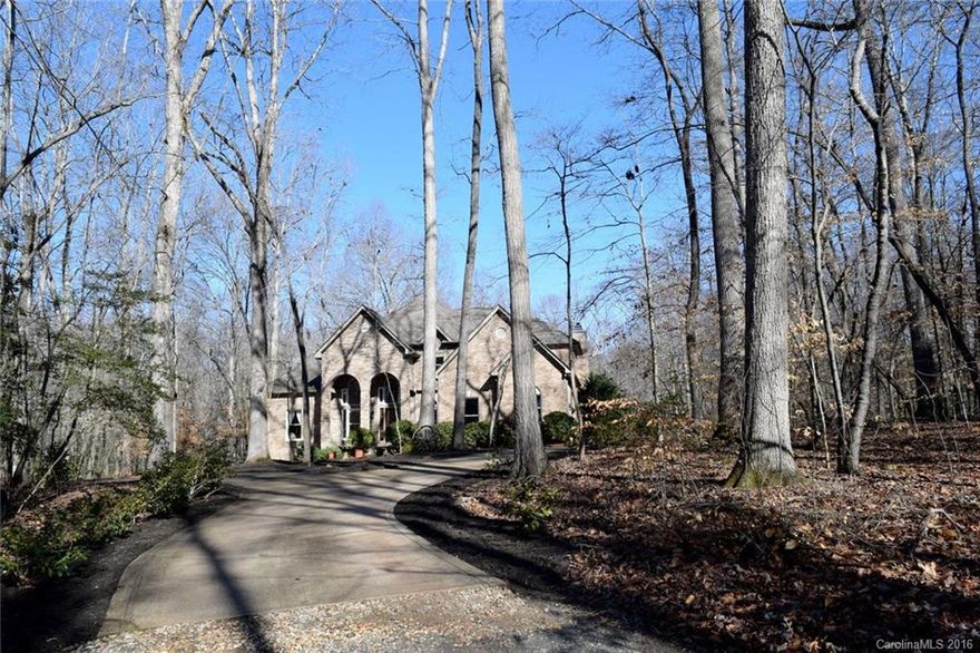 Great Updates! No compromises! This home is a contemporary style w/over 4000 square feet, 20+ acres, 48X60 barn, impeccably landscaped grounds, ponds & creeks, wooded areas, absolute privacy & a once in a life time opportunity. Barn has 6 stalls, tack room & wash bay. There are two open areas 12x48. Soaring ceilings, wood floors, arched openings, 4 bd 3 ½ bath. 2 living rooms, dining & bonus room. All new duct work & updated master suite! Very private, but convenient. Awe-inspiring backyard!