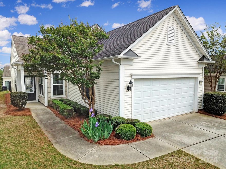 MOVE-IN READY Brookside home in the active-adult community of Sun City with brand new LVP flooring & a fully fenced backyard! Entering this 2 bed/ 2 bath home, you will immediately notice the abundance of natural light! Off of the foyer is the eat-in kitchen with stainless steel appliances and a dining area with windows overlooking the front porch. The pass-through window looks into the great room, which has 2 sliding doors (with panel track vertical blinds) that lead to the oversized back patio. At the rear of the home is the primary bedroom with 3 large windows and an en-suite bathroom with dual sinks, a glass shower, a small window for added natural light, & a large walk-in closet. The guest bedroom & hallway bathroom make hosting overnight guests easy! Come experience everything that Sun City has to offer,  including a golf course, tennis courts, pickleball courts, indoor & outdoor pools, a club house, and so much more!