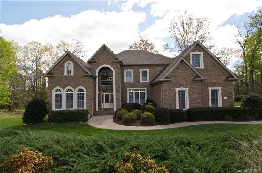 Come home to three levels of luxury in this custom water view home! Wonderful open floor plan is great for entertaining! Spacious master suite on main level with spa-like bath and huge closets. Lower level is nicely finished with versatile rooms, full bath, workshop and tons of storage. Upstairs there are three good sized bedrooms plus a bonus room with wet bar. Fantastic sun porch and screened porch are great places to relax and enjoy the views. Too many upgrades to mention! Clover schools too!