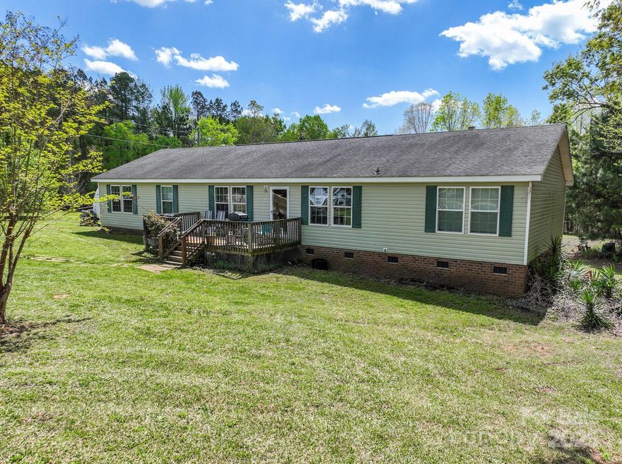 New Listing in Lancaster, South Carolina
This delightful four-bedroom, two-bath modular home showcases a living room, den, dining area, and a spacious kitchen equipped with a breakfast bar and ample cabinet and pantry space. Experience the comfort of roomy spaces with an open layout. The primary bedroom features a separate sitting area, ideal for a cozy living room or office. The master bathroom is generously sized, offering dual sinks, a large garden tub, a separate shower, and a vast walk-in closet. Nestled on over 2 acres, the property includes a four-wheeler trail that leads to a deer blind, making it a perfect spot for hunting enthusiasts. Don’t let this opportunity slip away—schedule your showing today!