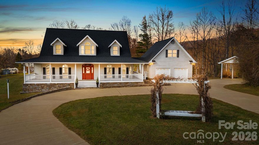 Tucked away in a community just minutes from downtown Black Mountain, this inviting mountain retreat provides privacy, charm, and easy access to everything Western North Carolina has to share. Set behind handsome stone entry pillars and a sweeping driveway, this home offers timeless curb appeal, an ideal balance of space and comfort in a peaceful setting. Surrounded by nature, featuring light-filled living spaces, large bedrooms, and thoughtful details designed for everyday living and relaxed entertaining. The detached garage and generous drive with carport provide ample parking and storage, ideal for daily living or hosting guests. Hidden, is a large storage shed perfect for a spacious workshop or hobby enthusiast, let your imagination take over and begin creating! Enjoy crisp mountain mornings and tranquil evenings outdoors, with space to unwind and reconnect with nature. Whether you’re seeking a full-time residence, second home, or investment opportunity, this property delivers the perfect blend of serenity and convenience—just a short drive to Asheville, hiking trails, and local favorites in Black Mountain.