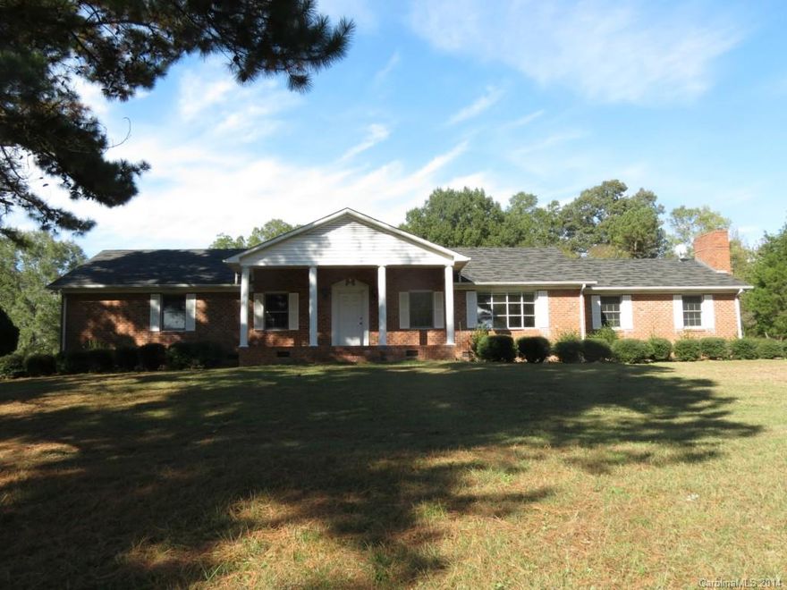 This beautiful 3 BR & 2.5 BA home is located on 15 acres with a barn and fenced pastures. This home features a formal living room, formal dinning room, eat in kitchen with work island, den with wood burning fire place, 2 car carport,  and screened back porch. It is located on 9 ac that features fenced pasture and barn on a rolling topo perfect for horses.