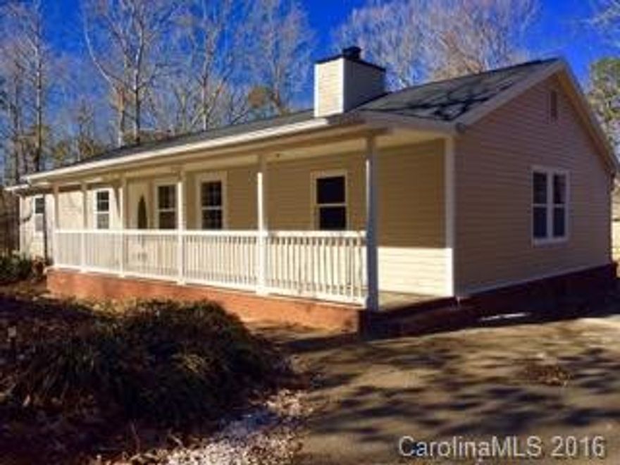ROCKING CHAIR FRONT PORCH,  UPDATED 4BR/2BATH HOME .48 acres LOCATED IN MINT HILL, GREAT LOCATION ON QUIET STREET, PRIVACY WITH WOODED SURROUNDINGS. BACK DECK OVERLOOKING PRIVATE BACKYARD. THIS BEAUTIFUL HOUSE HAS BEING FULLY RENOVATED, NEW VINYL SIDING AND NEW ROOF,  MOVE IN READY HOME WITH CLEAN NEUTRAL UPDATES,  USDA FINANCING AVAILABLE.