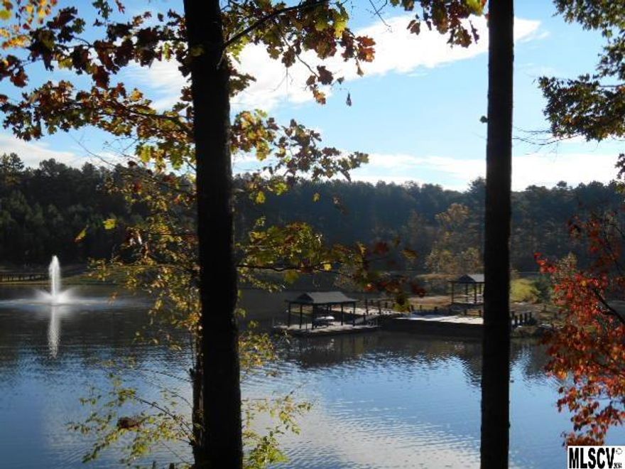 1.76 acre wooded lot in cul-de-sac, level building area. Gated community located on Lake Hickory includes clubhouse, swimming pool, stocked fishing lakes, paved hiking and bike trails. This property is located on the water front of Emerald Lake with a beautiful view of the fountain and located near the community dock. Over 20 private and public golf courses located nearby.