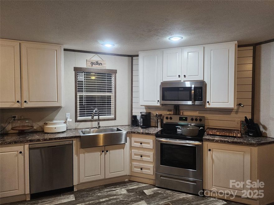 Here's your chance to start the New Year in an almost brand new single wide manufactured home with over 1200 heated square feet- all sitting on 5 private acres out in the country. It is now under contract but seller will review for backup offers.   Possible 100% USDA or VA financing for qualified buyers.  Zoned AGR/RES, horses and chickens/livestock are welcome.  This beautiful property begins with a long private driveway.  As you approach the property, you are welcomed by an above ground, manmade fish pond with gold fish.  Inside, you will find a gorgeous 3 Bedroom, 2 bath, Certified Energy Smart home.  The Primary bedroom has a barn door separating a welcoming ensuite private bath with a huge, oversized walk in glass/ceramic tiled shower, dual vanity, closet area and lots of cabinet and counter top space.  The kitchen features lots of counter space, stainless steel Electrolux appliances, recessed lighting and a hidden laundry area near the back door.  The 2nd bath is convenient to the living room and other 2 bedrooms.  Out back you will find a huge rear deck for entertaining and sunbathing.  Weather permitting, enjoy your 2 yr old large round above ground swimming pool. Sellers are motivated to sale NOW and will entertain any reasonable offer! Wishing to sell AS IS but sellers know of NO issues with the home  Only lived in for 3 years.