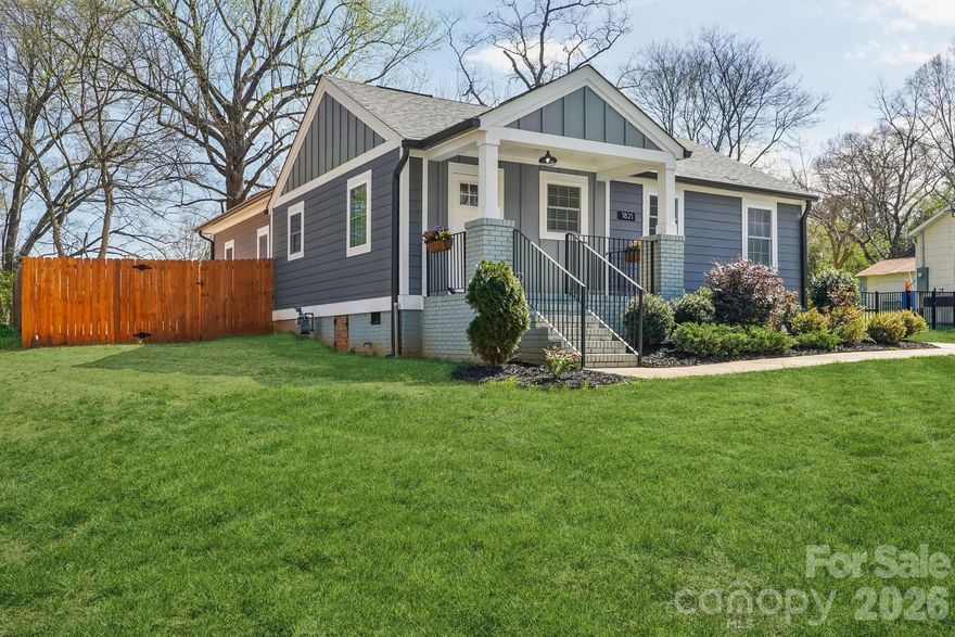 Located in the Camp Greene neighborhood, this home offers a blend of character and modern living in one of west Charlotte's most rapidly evolving areas. Known for its historic character, tree canopies, large lots and proximity to uptown, live here and be within minutes to center city, pocket parks, greenways, local restaurants, coffee shops, professional sports, Johnson C. Smith University, South End, NoDA and other favorite urban neighborhoods. Don't forget plans for The Iron District - slated to be a major entertainment, dining and employment hub. CLT Douglas International airport is just minutes away too. So convenient! The location is spot on - if you are looking for that urban lifestyle. Now, let's step inside - this home is filled with natural light and features beautiful real hardwood flooring throughout and spacious, open living areas. Truly the chef's kitchen - designed for both function and style includes a large island with quartz countertops, a gorgeous tiled backsplash, stainless steel appliances, a microwave drawer, gas range, and smart refrigerator. The primary suite is large and spacious with 2 closets. Custom tile in baths add a touch of luxury. The outdoor living shines complete with a private deck and includes an outdoor electric screen - imagine movie nights under the stars overlooking your large fenced backyard with a panoramic view of the Queen City skyline. (Ask listing agent for the proposed plan for a backyard pool area.) All mechanicals, roof, electrical, plumbing new in 2022. Dead end street - no cut through traffic! Turn key.  Move in and start living the dream!