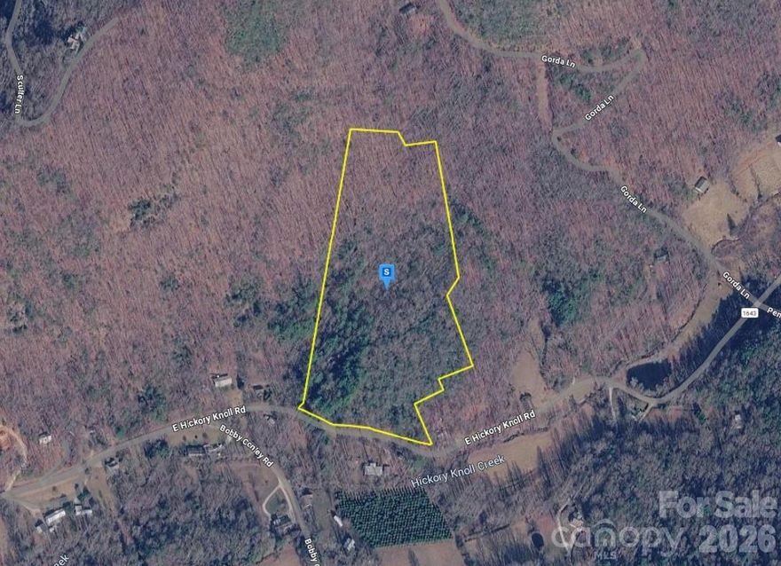 This vacant lot offers an excellent opportunity to build your future home or make a smart investment. Situated in Hickory Knoll Subdivision, the property features 14.57 acres with rolling terrain. Well and septic are required. Enjoy a peaceful setting while remaining conveniently located near shopping, dining, schools, and major highways, providing easy access to city amenities. Whether you’re looking for a private retreat, a development opportunity, or a long-term investment, this lot provides the flexibility and location to suit your needs. Listing is for land only and comes As Is. Street addresses can be for listing purposes only and vacant land will receive a true street address once improved.