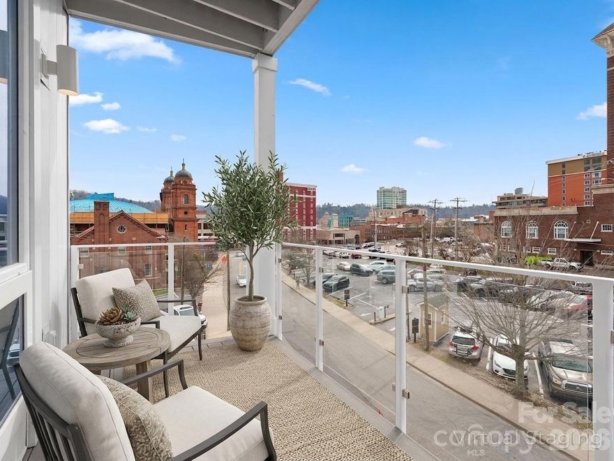 Discover elevated urban living at One23 Haywood, where modern design and an unbeatable downtown Asheville location come together seamlessly.

This thoughtfully designed 1-bedroom, 2 full bathroom residence with a versatile flex space offers a rare and highly functional layout, ideal for both everyday living and hosting guests. Expansive floor-to-ceiling windows fill the home with natural light while showcasing beautiful year-round mountain views, creating a bright and inviting atmosphere throughout.

The open-concept living, dining, and kitchen areas are designed with both style and functionality in mind, featuring clean lines and contemporary finishes that elevate the space. The primary suite offers a comfortable retreat, while the additional full bathroom provides added convenience—perfect for guests or shared living. The flex space adds exceptional versatility, easily serving as a home office, guest accommodations, or a creative studio.

Enjoy your own private balcony, perfect for relaxing or entertaining while taking in the vibrant surroundings.

Located in the heart of downtown Asheville, just one block from the iconic Grove Arcade, this residence offers exceptional walkability to the city’s best dining, shopping, and entertainment.

Residents of One23 Haywood enjoy a curated lifestyle with concierge service and a secure community environment. Located within Asheville’s designated short-term rental overlay district, this residence allows for short-term rentals, making it an exceptional opportunity for both personal use and investment. For investors, Towns Management can provide short-term rental performance data, offering valuable insight for those looking to add to their portfolio.

Experience modern, flexible living at One23 Haywood, where thoughtful design meets convenience and style in the center of it all.