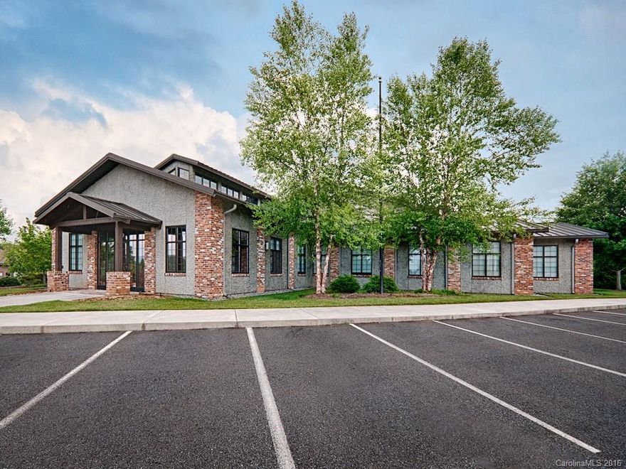 Possibly the finest  property in Western North Carolina, featuring a warm reception area with stone fireplace, vaulted ceilings, lots of wood trim, glass conference rooms, security cameras, a large beautiful breakroom, lots of windows etc.