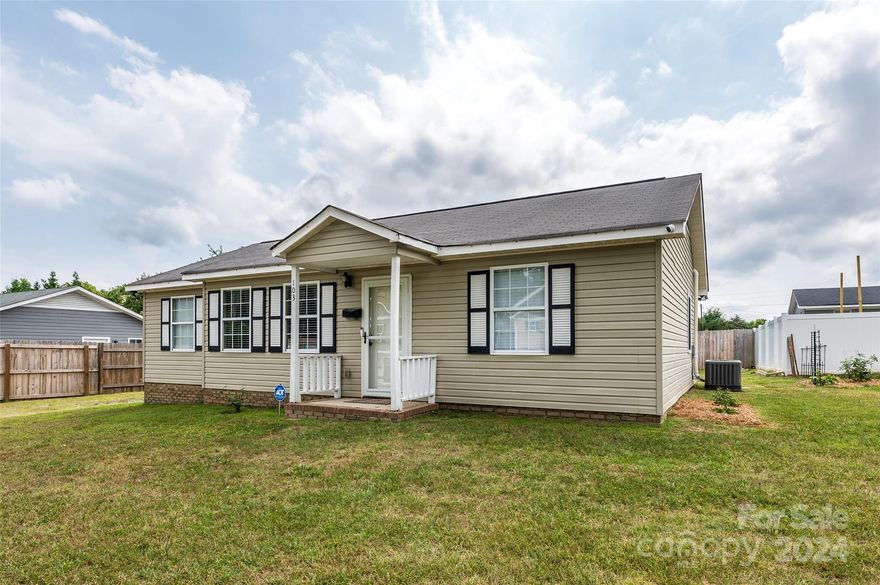 Great home in Clover is ready for its new owner! This ranch home has laminate floors that flow through the large living room down the hall and into the bedrooms. The eat in kitchen has tile floors, stainless steel appliances that are only 2 years old, ample cabinet and counter space, access to the laundry room with shelves and cabinets, as well as the door leading to the back yard. The split floor plan features the primary suite with private half bathroom on one side of the house and the other spacious secondary bedrooms are located on the other side. The newly renovated full bathroom has tile floor, walk in shower, new toilet and new exhaust fan with a Bluetooth speaker. Relax or entertain in the oversized yard. Large building for all your storage needs is located in the side yard. All the insulation in the attic was also just upgraded as well as some of the wiring in the house. Home also has 2 driveways for your convenience.