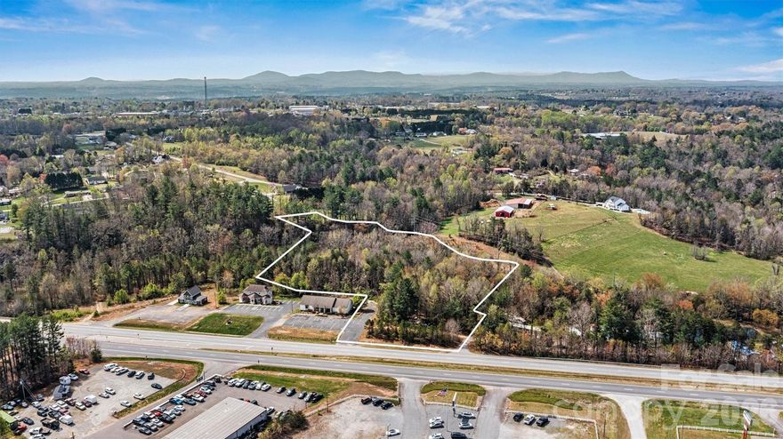 Positioned for maximum exposure, this 4+ acre commercial tract in Granite Falls offers a prime opportunity for investors and developers seeking visibility, access, and long-term growth potential. Located just off U.S. Highway 321, the site benefits from strong daily traffic counts and excellent road frontage, ideal for a wide range of commercial uses.

Enhancing its natural appeal, a small stretch of Little Gunpowder Creek runs along the rear property line, adding a unique buffer and subtle natural backdrop to the site.

Strategically located less than 3.5 miles from Caldwell Community College & Technical Institute and approximately 10 miles to Downtown Hickory, the site sits within a well-established and growing regional corridor with strong surrounding demand for goods and services.

Convenience extends beyond the local market, with the property located less than 60 miles from Charlotte Douglas International Airport, enhancing regional and national accessibility for business operations.

Outside city limits, the property benefits from no city taxes and is subject only to Caldwell County and Sawmills Township rural taxes, enhancing overall investment efficiency.

With excellent visibility, premium highway frontage, and a strategic location within a growth corridor, this property presents a compelling opportunity for development, expansion, or long-term investment positioning. 

Opportunities like this are rare in today’s market, schedule your tour today and secure a prime commercial investment before it’s gone.