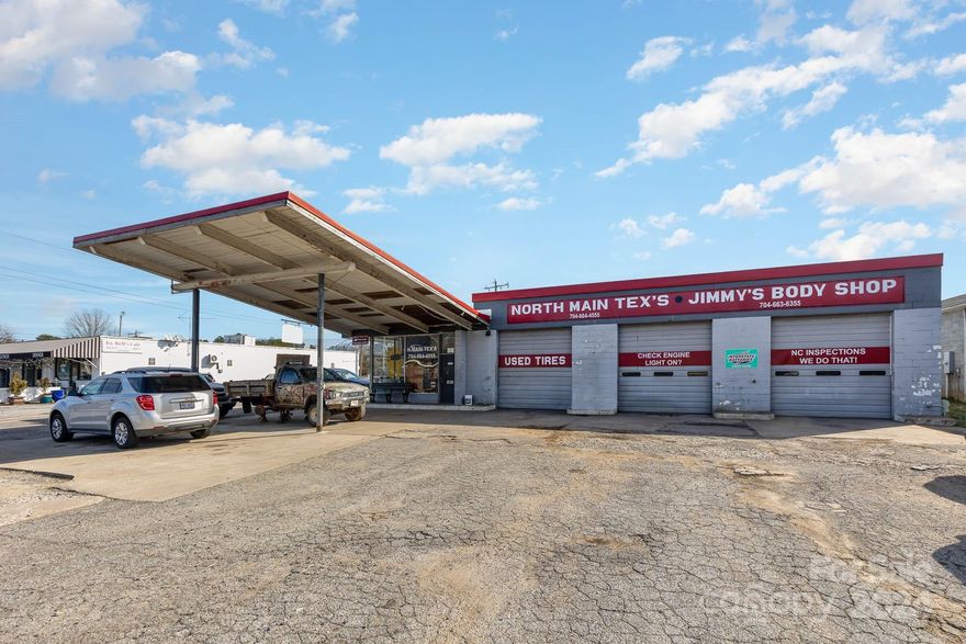 Terrific business opportunity! Bring your business to this excellent location! Service station and Auto Repair shop, HVAC in Office and Work area. Great visibility with at 108 feet of road frontage downtown Mooresville right near the  (newly controlled) intersection of Linwood and North Main St and a few doors down from the Food Lion shopping center. Lots of development going on in this area. Great opportunity to bring your business to this location with 5,067n sqft of space and a rare to find fenced in rear yard. There are 3 bays in the front, an office and behind it is another work area/office and where the current paint booth is located. There are two exterior accessed bathrooms. In recent years (2.5 apx) they added a 37.5 x 38.5 garage with three 12 feet high garage doors and - natural gas metal roof covering the old and the new section. Sprinkler system in mix room and paint booth (booth negotiable), AC in office Please do not disturb the current owner - shown by appointment only.