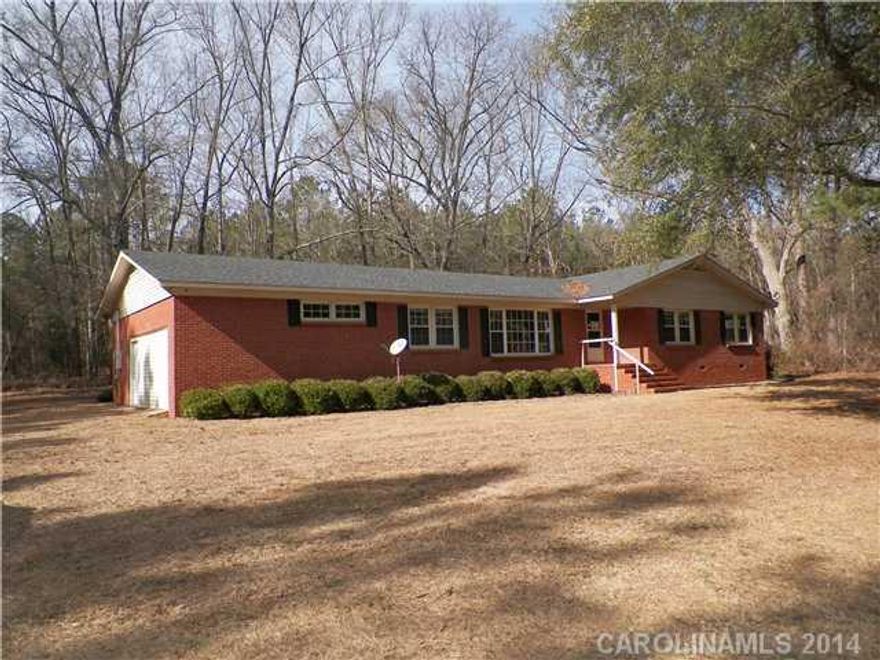 JUST REDUCED!!!  Attractive brick ranch located in established area of Hartsville.  This spacious home features four bedrooms, two bathrooms, den with FP, living room, kitchen, dining area, utility room with work sink and enclosed garage/recreation room. Make this house your home with some update ideas.