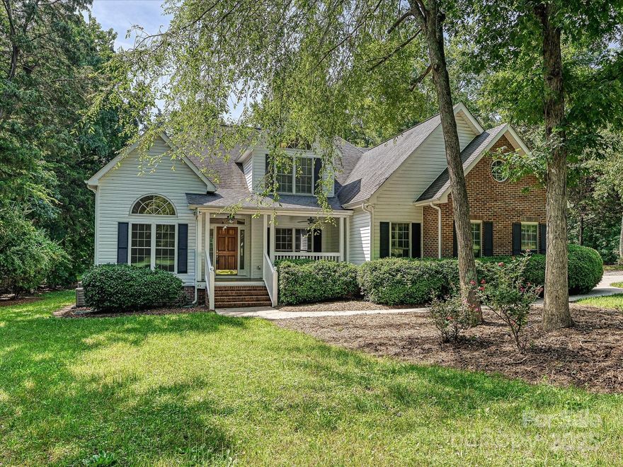 Don’t miss this rare opportunity to own a home in the desirable Hamilton Place neighborhood! Located on the SC side of the community within the popular Fort Mill School District! Partial brick home; oversized side load garage with built in storage; owners suite and a study or additional bedroom and full bath on the main level; two bedrooms and a huge bonus room/bedroom upstairs; beautiful updated kitchen with granite countertops, island with quartzite top, double wall oven, gas cooktop, lots of drawers, high end cabinets, and ceiling beams; gorgeous updated owners bath with “air-jetted“ soaking tub; two story great room; numerous vaulted ceilings; pocket doors; sliding doors leading to huge rear deck; incredible storage barn with three 10x16 sections; private rear yard; mature trees and beautifully landscaped 1 acre lot.