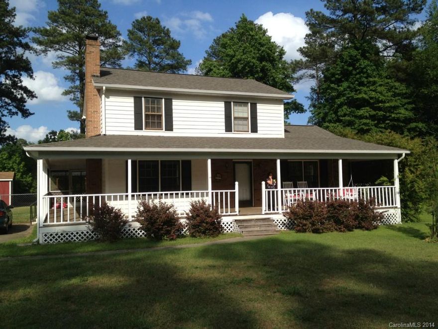 Southern Rocker Porch on the Charming 3 BR Home 2.5 BAs. Relax on the wrap around covered porch, sip sweet tea on the swing and survey your land (.92 Acres). Plenty of room inside.  Large kitchen opens to a spacious dinette. The laundry room is on the main floor. One extra room main floor. Remaining Bedrooms are upstairs. Large screen porch on back. Huge Storage Shed. Most of the yard is fenced. Low county taxes. Home is also available for a lease purchase.