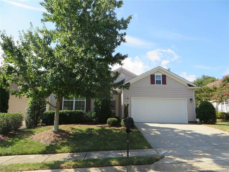 IMMACULATE RANCH home in active 55+ community in Ft. MIll. Spacious, open floor plan w/beautiful HWs thru main living areas, vaulted ceilings, wide crown molding & trim. Kitchen sparkles w/granite counters, tile backsplash, SS appliances. Bayed Breakfast Nook + serving bar/counter to Great Room that has fireplace & large Palladium window w/pretty views to the private, fenced patio area. Split BR plan. Master w/sitting area & large tiled bath w/dual sink vanity, corner tub & sep shower,2 closets.