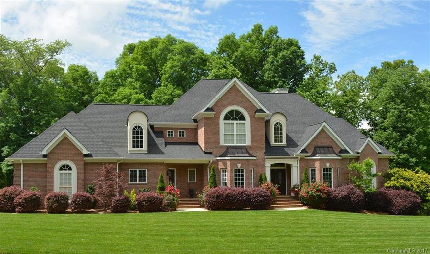 From the moment you step inside this immaculate home, with all its stunning architectural attributes, you’ll be impressed. It has it ALL; two luxurious master suites, elegant designer railings, extensive moldings and hardwoods, gourmet kitchen, dramatic 2-Story great room, open floor plan perfect for entertaining, abundant storage, screen porch overlooking manicured back-yard, wonderful theater room with wet bar. Too many features to mention.  Shows BETTER than a model home. This is a must see!