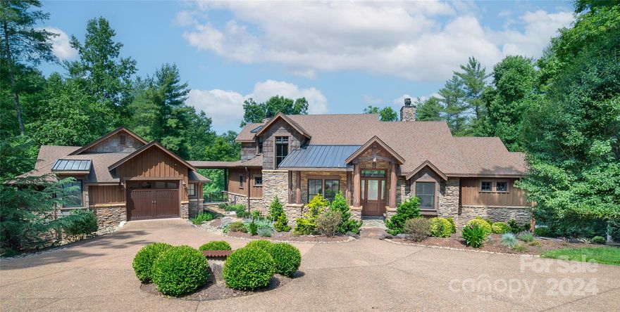 Custom built home on Lake James in the desirable community of 1780! Once you enter the landscaped circular driveway you will be in awe! This rustic home includes a covered boat dock w/ Hydro-Hoist boat lift, floating docks for jet skis, automatic outdoor lighting down to the dock and firepit for cozy nights. Gorgeous entryway with vaulted ceiling, wood beams and stone columns. Everything you need is on the main level inc. the guest house. Executive office, formal dining room and two living areas for endless entertaining. High-end chef kitchen featuring a Wolf 6 burner gas top stove, custom hood vent, decorative copper sinks and live edge granite. Primary bedroom ensuite w/ custom walk-in closet, soaking tub and dual side entry shower. Upper level offers plenty of room for family or friends. Lower level features a temperature controlled wine cellar, family room, game room and 2 bedrooms each with their own private bathroom. Half Bath and outdoor shower on lower patio. CLJ membership inc