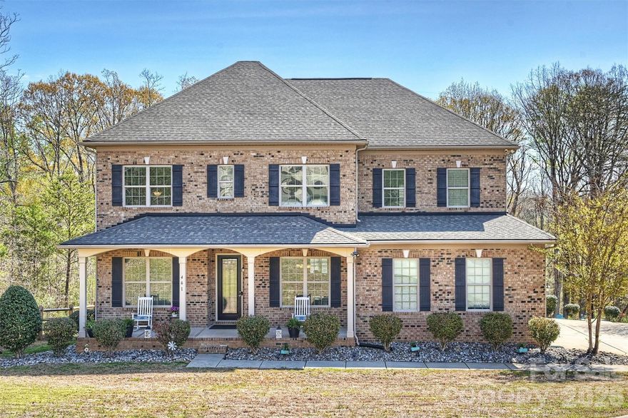 Located in a desirable Lake Wylie front community with seasonal water views, this beautiful all-brick home sits on a private .87-acre cul-de-sac lot surrounded by mature trees, offering both privacy and a peaceful setting. With 5 bedrooms and 5 bathrooms, the home provides ample space for comfortable living and entertaining.

The main level welcomes you with a dedicated office featuring double French doors, a formal dining room, and an open-concept layout that seamlessly connects the family room and kitchen. The chef’s kitchen is designed for both function and style with a gas range, stainless steel appliances, double oven, and under-cabinet lighting. Storage is plentiful with a butler’s pantry and a walk-in pantry.

A spacious bedroom and full bathroom on the main floor provide an ideal setup for guests or multi-generational living. Upstairs, a large loft area offers flexible living space, while the primary suite features a luxury ensuite bathroom and a huge walk-in closet. Two additional bedrooms each include their own full bathrooms, and an additional bonus/family room on the upper level makes entertaining easy.

The finished basement is designed for gathering and relaxation with a media room, bar area with a wine fridge and ice maker, and a family room. Also includes an office/room with closet space and spacious enough to accommodate a king bed. Step outside to enjoy the stone patio with a firepit and outdoor kitchen, creating the perfect space for entertaining or relaxing evenings at home.

The home also features an extra-wide driveway and a three-car garage, providing plenty of parking. Neighborhood amenities include a pool and clubhouse, and the property is conveniently located just 10 minutes from Hwy 557, restaurants, shopping, and more. This home offers the perfect blend of privacy, space, and Lake Wylie lifestyle living.