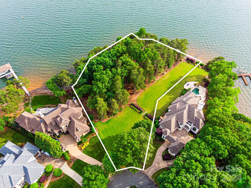 RARE, once in a lifetime opportunity to own the last two adjacent waterfront parcels in Cornelius's most coveted neighborhood, The Peninsula! This open channel point lot has spectacular Lake Norman views with over 373+ feet of shoreline, seawall, and riprap! Enjoy watching stunning sunsets, sailing regattas, boaters, and beautiful wildlife. The Peninsula offers an unparalleled premier lake and golf lifestyle community, convenient to The Peninsula Club, The Peninsula Yacht Club, I-77, Charlotte Douglas Airport, uptown, shopping, restaurants, and all Lake Norman water activities. Parcels can be combined into one building envelope or remain as two separate lots. See attachments for Williams Pipeline build requirements and driveway easement application, town setbacks and impervious information, and current survey. City water and sewer at street, tap fees required. Don't miss this incredible opportunity to build your dream estate on the most coveted lots in the neighborhood!!