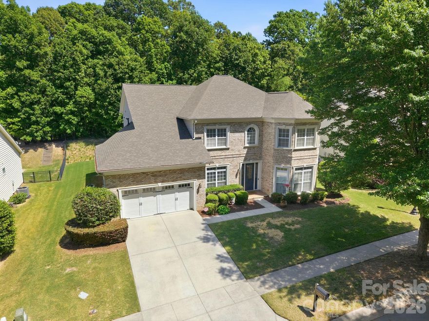 Welcome to 204 Black Mountain Drive, the kind of home that makes you want to slow down, settle in, and imagine your life unfolding here. Located in one of Fort Mill’s most desirable communities, this 4-bedroom, 3.5-bath home offers elegance, warmth, and inviting spaces designed for everyday enjoyment. From the moment you step inside, the gracious foyer welcomes you into a home filled with comfort and character. The private office and den offer flexible spaces for work, reading, or quiet relaxation, while the family room draws you in with a stunning stone fireplace, creating the perfect place to gather. The gourmet kitchen is the heart of the home, featuring granite countertops, double ovens, a generous walk-in pantry, and a bright breakfast nook overlooking the private backyard. Two screened-in porches extend the living space outdoors, offering peaceful spots for morning coffee, evening wine, or simply enjoying the view. Upstairs, the luxurious primary suite feels like a true retreat, complete with a spacious sitting area and a spa-inspired bath. Bright additional bedrooms provide comfort and flexibility for family, guests, or hobbies. With beautiful indoor and outdoor living spaces, refined details, and a setting you will love, this Fort Mill home is one you will want to experience in person.