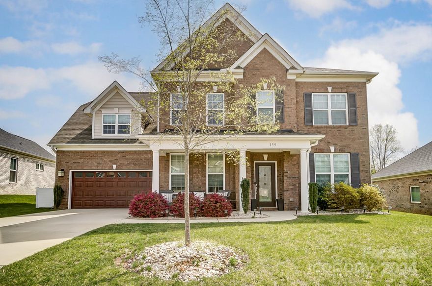 Beautiful, full brick home in highly sought after school district. Gorgeous coffered ceiling in the dining room welcomes you & continues into the great room. Wonderfully bright w/natural light showcasing beautiful, pre-finished hardwoods that run throughout the main floor & up to hallway upstairs. Light, neutral paint. Flex space for office/den. Cabinetry w/glass doors, soft close drawers, granite, SS appliances, wall oven, gas stove, butler's pantry. Walk-in pantry. Private guest bedroom/second primary suite downstairs tucked away for full privacy with en-suite bath. Separate powder room. Primary has dual vanities, glass shower, garden tub, custom closet w/secondary access to laundry room. Huge media room w/surround sound speakers & movie projector. Finished garage. Extra large covered paver patio w/beadboard ceiling, fan, in-ground gas tap for grill. Tanklesss water heater. Huge backyard. Ring security system remains. No interior photos available, but the home shows beautifully!