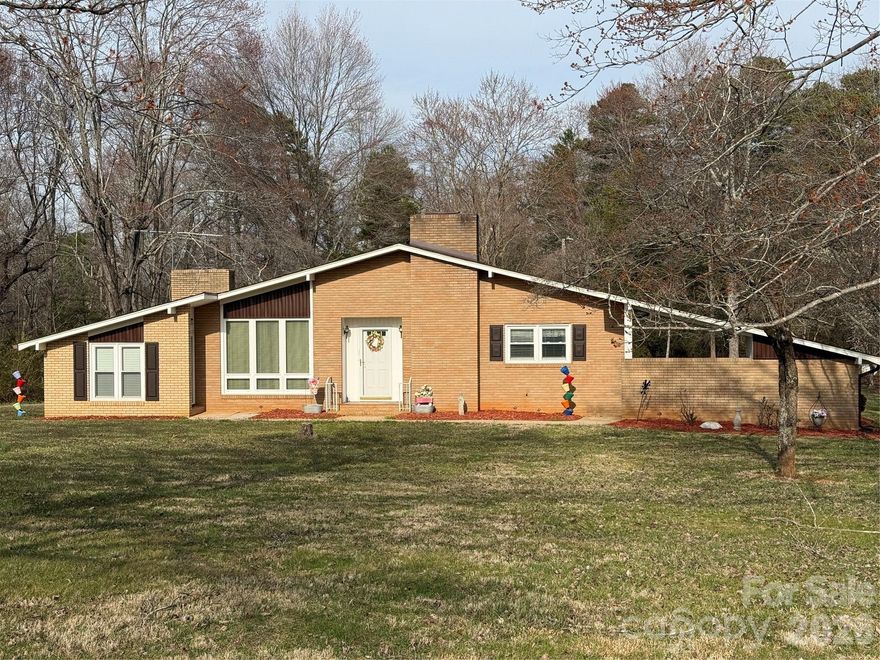 RANCH HOME ON 1.5 ACRES, REMODELED IN 2017-2018.  2 BEDROOMS, 2 BATHROOMS.  EAT-IN KITCHEN.  LIVING ROOM AND DEN- DEN HAS A FIREPLACE!  MAIN LEVEL LAUNDRY FOR A STACKABLE WASHER/DRYER.  
BIG, 1,174 SQ FT BASEMENT.  ATTACHED CARPORT, PLUS 487 SQ FT DETACHED GARAGE.  ADDITIONAL 619 SQ FT OUTBUILDING.  NEW HEAT PUMP INSTALLED 12/25.  SUPER CLEAN & READY TO GO!