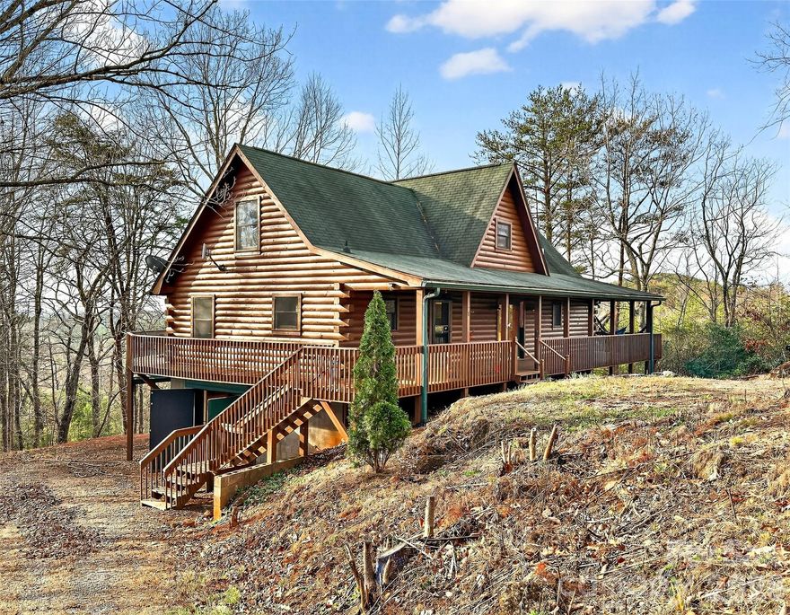 Escape to the mountains with this spacious cabin offering nearly 2,000 square feet of comfortable living space plus a full basement on 5.72 private acres. Though it's just a short distance from the community entrance you will enjoy long-range mountain views stretching as far as Crowders Mountain while relaxing on the expansive wraparound deck that surrounds the main level—perfect for entertaining or simply taking in the peaceful setting.
Inside, the home features a spacious kitchen with a breakfast bar that opens to the main living area, creating a welcoming space for gathering with family and friends. Storage is abundant throughout the home, providing plenty of room for organization and hobbies.
The partially finished basement adds incredible versatility, serving as a garage while also offering heated and cooled space that includes a dedicated office or craft room and an exceptional wood shop complete with a dust collection system—ideal for woodworking enthusiasts or anyone needing a serious workshop area.
The cabin exterior was freshly stained in August 2025, and wood bee treatment is in place through December, offering added protection and peace of mind.
With privacy, usable acreage, and stunning mountain views, this unique property combines mountain charm with practical space for work, hobbies, and everyday living.