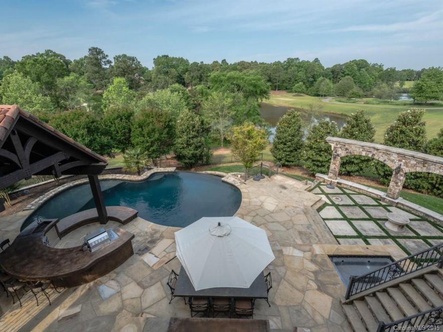 Absolutely STUNNING Mediterranean Master Piece located on one of Ballantyne Country Club's most scenically beautiful settings overlooking the lake & course holes 4 & 6. Outdoor Oasis w/vanishing edge pool, outdoor kitchen & covered seating area w/stone fireplace & vaulted ceiling. Full bath. The perfect place to relax or  entertain. Gorgeous 2 story great rm, main floor master w/spa bath. 3 secondary suites up & 2 w/private balconies. Lower level w/media, exercise, billiard, guest suite & MORE!