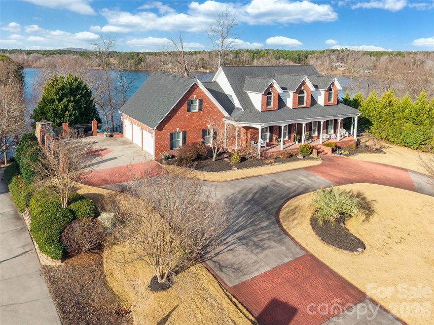 Exceptional lakefront living on Lake Wylie, set on nearly one acre (.98) with stunning water views and unmatched amenities. This 4-bedroom, 4.5-bath home offers a thoughtfully designed floor plan ideal for everyday living and entertaining. The main level features a spacious primary suite with a private ensuite bath, along with a well-appointed kitchen complete with a gas range, double ovens, and generous workspace, all flowing into the main living areas.

The upper level includes two additional bedrooms, each with access to its own full bathroom, providing comfort and privacy for family or guests. The fully finished basement expands the living space with a large living area, multiple bathrooms, an insulated room perfect for music or studio use, and a pool table that conveys.

Step outside to your private lakefront retreat featuring an inground pool with liner replaced last year, multiple patios, and an outdoor fireplace—ideal for relaxing or entertaining year-round. A golf cart path leads directly to the floating dock. Additional highlights include a 3-car garage on the main level plus a golf cart garage, circular drive, large front porch, and whole-home audio with three interior music zones and three exterior zones.

A rare opportunity to own a premier lakefront home combining luxury, lifestyle, and recreation on Lake Wylie