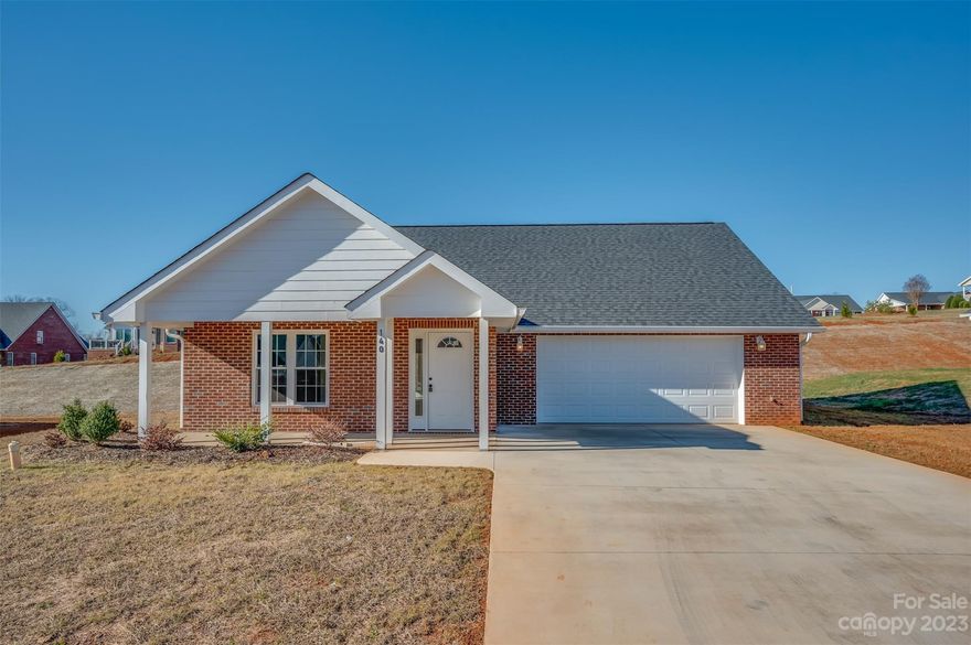 Beautiful new construction home located in Sparks Crossing, a well-established 55+ community. This 3-bedroom, 2 full bath floorplan has just under 1700 sq ft of living space. Features include wide doorways, vaulted ceilings, a beautiful gas log fireplace, large pantry, granite countertops, and soft close cabinets/drawers. The 2-car garage and walk in closets are oversized and offer ample space for extra storage, if needed. A relaxing screened porch on the back of the home is the perfect spot to enjoy the outdoors after a long day. Sparks Crossing is a 55+ community with an HOA that maintains the landscaping. It also provides two stocked ponds, underground utilities, public water and sewer, and has very easy access to the Thermal Belt Rail Trail. Don't miss the opportunity to call Sparks Crossing your home!