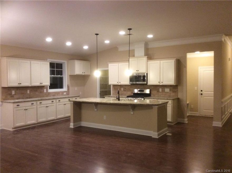 Cozy ranch home with an exquisite covered porch. This 3 bedroom 2 bath ranch home is perfect for those looking to downsize with compromising elegance. Gorgeous appointed kichen that your sure to fall in love with. Our most Antique cabinets with stainless appliance, charming backsplash and an array of details that your sure to fall in love with! It's love at first sight with extensive hardwood floors, fireplace, elegant crown details and a stunning kitchen!