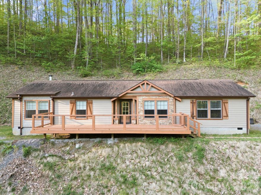 Built in 2019, this inviting 3-bedroom, 2-bath home offers approximately 1,809 sq ft of living space on 5.89 private acres at 193 Tipstill Cove in Waynesville. The property includes dedicated garden space and features a year-round spring running through the land — a rare and peaceful natural touch. Enjoy exceptional privacy while still being just approximately ½ mile from the interstate with no road noise. Ideally located, the home is approximately one mile from the entrance to the Blue Ridge Parkway and about 15 miles from Harrah's Cherokee Casino Resort. Just minutes from downtown shopping and dining, the home also provides convenient access to hiking, scenic mountain drives, skiing at nearby resorts, and mountain views. Don't wait — schedule your private tour today!