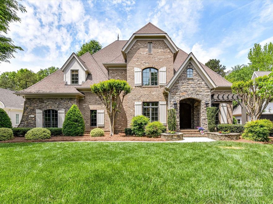 Nestled within one of Davidson's most sought-after neighborhoods, this grand 5 bedrm, 4 full and 2 half-bath residence offers nearly 5,500 sf of refined living space, crafted to impress at every turn. The gourmet kitchen is the heart of this home, featuring premium appliances, a spacious working island, and an adjacent butler's pantry. Flanking the expansive foyer are an elegant formal dining room and a richly appointed office or formal living room. Recently refinished elegant cherry wood floors flow throughout most of the main level and upstairs hallway adding warmth and sophistication. The main-level primary suite offers convenience and privacy, while the second floor boasts three spacious bedrooms, two full baths, and a versatile, two-tiered media/bonus/billard rm. The third floor features a private bedrm, sitting area and full bath. Outside, enjoy your own private sanctuary w/ covered porch with fireplace and beautiful salt-water pool w/hot-tub! Great schools and walk to Davidson!