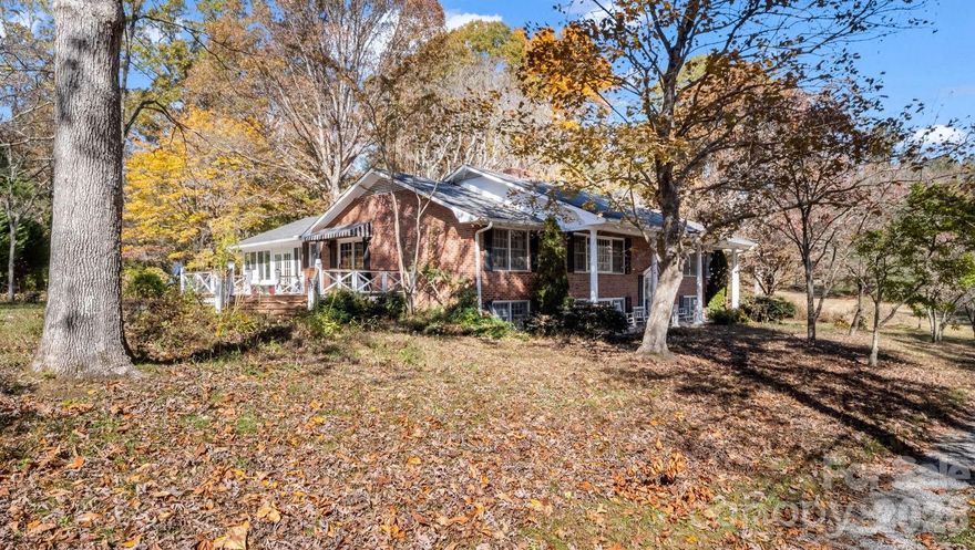 Welcome to this spacious home set on an even more expansive piece of land in the heart of apple country, offering the best of rural tranquility while remaining just minutes from town. Nestled atop a gentle slope, the home enjoys a peaceful, private setting with lovely views and abundant outdoor space to relax or entertain.

Inside, you’ll find flexible living areas ready for your personal touch, including a light-filled sunroom and two inviting fireplaces that create warmth and character throughout. The home offers tons of storage space, making it easy to stay organized while accommodating hobbies, seasonal décor, or outdoor gear.

The walkout basement features a full apartment complete with its own kitchen and laundry—perfect for guests, multigenerational living, or potential rental income. In spring, the property comes alive with gorgeous flowers, adding even more charm to this already picturesque setting.

A wonderful opportunity to update, customize, and truly make it your own in a serene country location!  Seller willing to negotiate price to reflect needed updates.