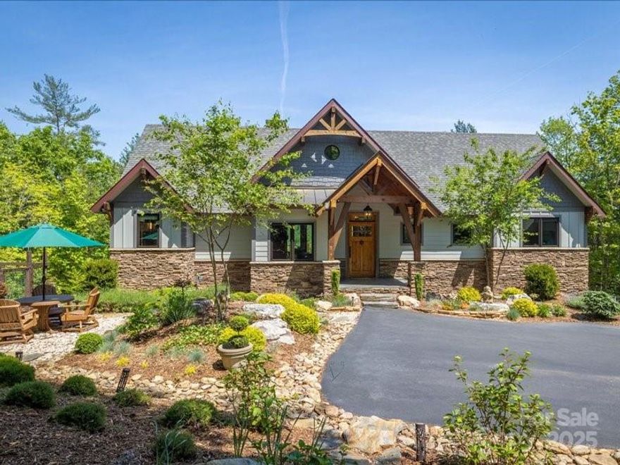 Welcome to this picturesque home located in cherished 1780 on Lake James. From the moment you enter through the private gated driveway, you'll be captivated by panoramic mountain views and beautifully landscaped grounds. Timeless charm shines through with the warm front porch and rich wood and stone accents. The main level features vaulted ceilings, a cozy stone fireplace, well-appointed kitchen, and a luxurious primary suite—all designed for comfort and connection. Expansive windows throughout the home frame magnificent views of Shortoff Mountain, while the back deck and inviting four-season room offer serene spaces to relax and take it all in. The lower level provides abundant space for guests, complete with a large recreation room, wet bar, and three additional bedrooms. A detached two-car garage provides room for tools and toys. This home also includes a nearby deeded boatslip and full membership to beloved Camp Lake James—offering endless outdoor adventure and community amenities.