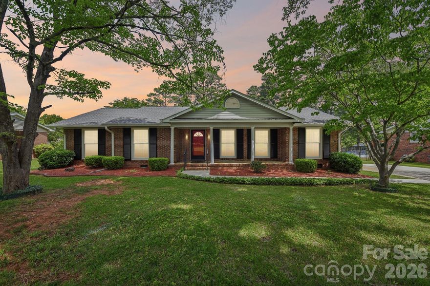 1019 Christopher Circle — Where the Next Chapter Begins

Decades of love lived here. Now it's ready for yours.
This classic brick ranch sits on an oversized, tree-lined lot in one of Rock Hill's most established neighborhoods — the kind of lot you simply cannot replicate in new construction. From the long private driveway to the iconic red front door, the character starts before you even step inside.
The floor plan flows the way families actually live — formal living and dining rooms filled with natural light, a family room anchored by a fireplace and built-in shelving, and a kitchen updated where it counts: gas range, quartz countertops, and marble hex tile backsplash. The surprise is the sunroom — a full bonus living space wrapped in windows on three sides with direct backyard access. You'll be in there every morning.
And here's what makes this one a smart buy: new roof in 2024, HVAC replaced in 2020, and original hardwood floors hiding under the carpet just waiting to be uncovered. This home has been professionally maintained every single year. The big stuff is already done.
Flat, private backyard. Mature trees. Room to make it your own.
Great bones. Real character. One family.