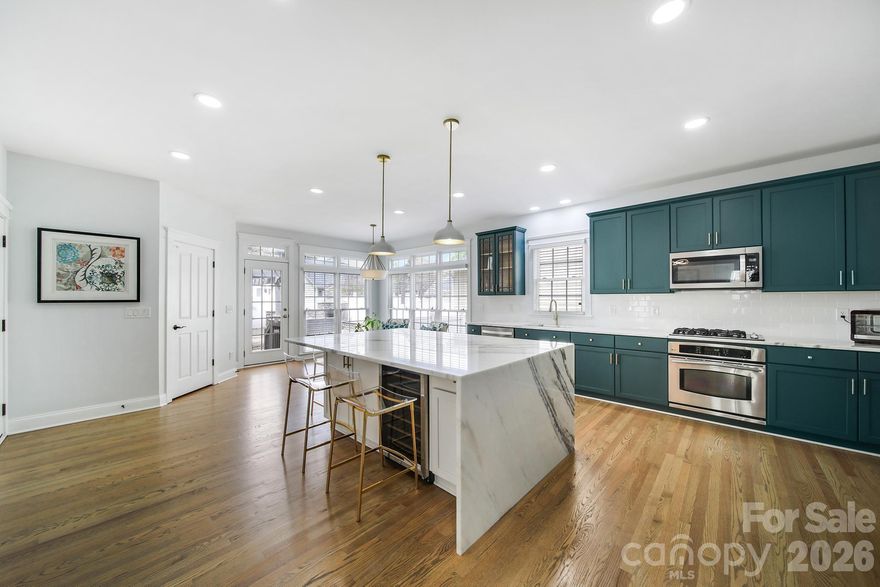 BEST VALUE IN BAXTER! Welcome to highly sought after Baxter Village  - Traditional Neighborhood Development. This thoughtfully updated two-story home featuring upgrades throughout and exceptional flexibility for modern living. The main level showcases a stunning updated kitchen with a waterfall marble island, beverage refrigerator, and a 2025 dishwasher, all complemented by updated lighting and fresh interior paint throughout the home. The spacious primary suite offers a fully upgraded bathroom with a standalone soaking tub, floor-to-ceiling tiled shower, and dual vanities. A custom-designed bookcase enhances the main-level flex space, opening seamlessly into the living area—perfect for a home office or additional lounge. Upstairs, enjoy a private second living space ideal for an in-law suite or guest retreat, complete with its own kitchen and separate exterior staircase for added privacy and convenience. This area could also could be used as an entertaining or bonus room space. Step outside to an extended paver patio featuring a fireplace and pergola seating area—perfect for entertaining or relaxing year-round. Additional highlights include an epoxy-coated garage floor and major system updates, including new plumbing (2015), water line to the street (2025), and improved landscape drainage (2023). Located within walking distance to Market Street, enjoy easy access to restaurants, a wine bar, parks, and a fitness center. Situated in desirable York County with low South Carolina taxes. This home is in excellent condition with extensive upgrades—schedule your showing today!