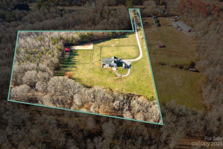 Hard to find equestrian property in Troutman! Beautiful home on 7.6 acres tucked back in the woods. Separate fenced areas for riding horses. Ride in metal building used as a barn. Trees surrounding the outskirts of the property. Such a peaceful property with abundant wildlife. This lovely home has 3 bedrooms on the main level with a split floor plan. Large primary bedroom with wonderful bathroom that features a huge jacuzzi tub, separate glass shower and two closets. Access to newly screened porch from primary bedroom. Kitchen has tons of cabinetry with center island. Dining room off the kitchen overlooks the scenic backyard. Huge unfinished basement with roughed in bathroom and workshop. Framed out and ready to be finished. Basement can be built out to accommodate a recreation room, work out room, office/den, bathroom and still have a large workshop! This property has so many possibilities. Plenty of room for additional buildings if needed.