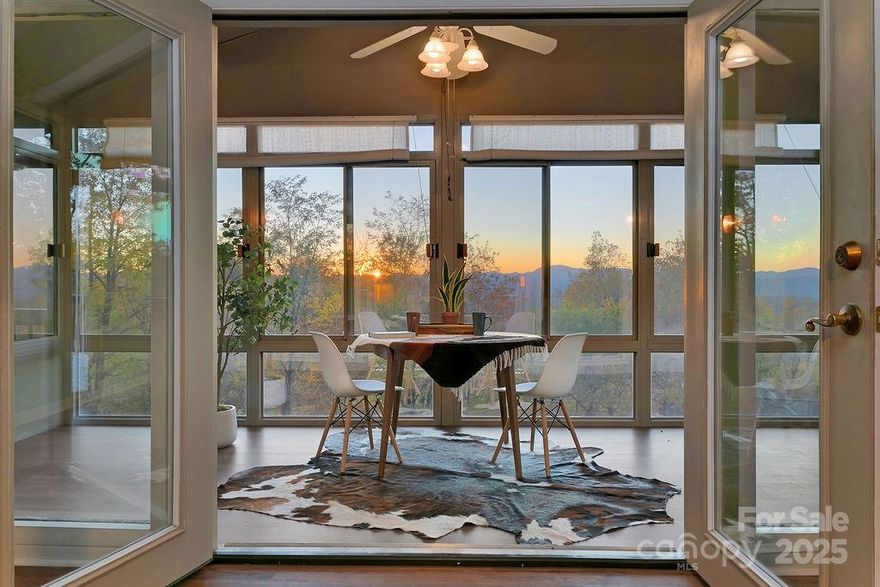 One of the best mountain views of homes currently on the market in Connestee Falls! Enjoy spectacular layered mountain views from this beautifully maintained home on 1.1 acres in the gated community of Connestee Falls. Its open floor plan is perfect for entertaining or simply relaxing while taking in the stunning long-range mountain vistas.

Its newer HVAC systems, hot water heater, kitchen appliances, and washer and dryer ensure modern efficiency and peace of mind. The fenced-in yard offers a safe space for dogs to roam freely, while raised garden beds provide an ideal setup for homegrown vegetables, herbs, or flowers. While this home is move-in ready, a 3-bedroom septic permit is on file with Transylvania County, allowing for ease of expansion on the double lot. 
Set in a quiet, private location within Connestee Falls, you’ll enjoy the best of mountain living along with the many community amenities this popular neighborhood offers. Connestee Falls features four mountain lakes, a championship golf course, tennis and pickleball courts, a swimming pool, fitness center, hiking trails, clubhouse dining, and vibrant community clubs and events.

Whether you’re seeking a full-time residence, mountain getaway, or investment opportunity, this home offers the perfect blend of comfort, nature, and convenience—just minutes from downtown Brevard, known for its charming shops, restaurants, and outdoor adventures.
Come experience the beauty, privacy, and lifestyle of Connestee Falls—and let the mountain views welcome you home.

Please note:  There is a one-time amenity fee to the CFPOA of $13,500 if paid at closing.  There is a lawsuit pending with the CFPOA regarding short-term rental restrictions.