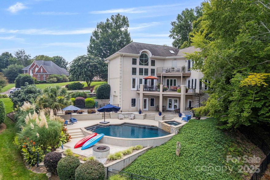 Discover the best of lakefront living in this custom-designed 5-bedrooms, 4.5 bath on Lake Wylie. With modern Art Deco flair, soaring ceilings, and walls of windows showcasing stunning water views, this home was built for both relaxation and entertaining. Enjoy a chef’s kitchen with high-end appliances, a full walkout basement with media room, multiple terraces, and an inground pool with outdoor living space. Perfect for multi-generational living or your dream retreat on the water!”  
Be sure to see the Matterport Video!