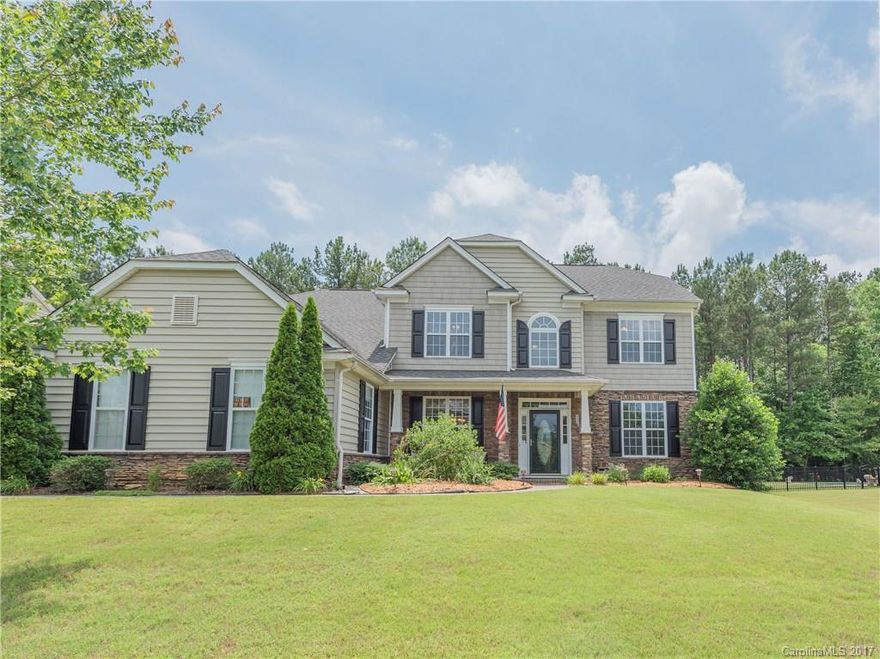 FANTASTIC HOME: Open floor plan, freshly painted, move in ready! The "Entertainer's Kitchen": Over sized kitchen with breakfast bar, center island, & tons of counter/cabinet space. 6 Large bedrooms, with one bedroom/full bathroom on main level, 3 full BA,  & fireplace in large beautiful great room with surround sound! Backyard boasts tree views and privacy for morning coffee or evenings with wine! This home is truly stunning, close to shopping/dining.  Community pool/playground/clubhouse. HURRY!